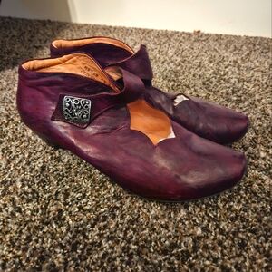 "Think" cranberry colored shoes